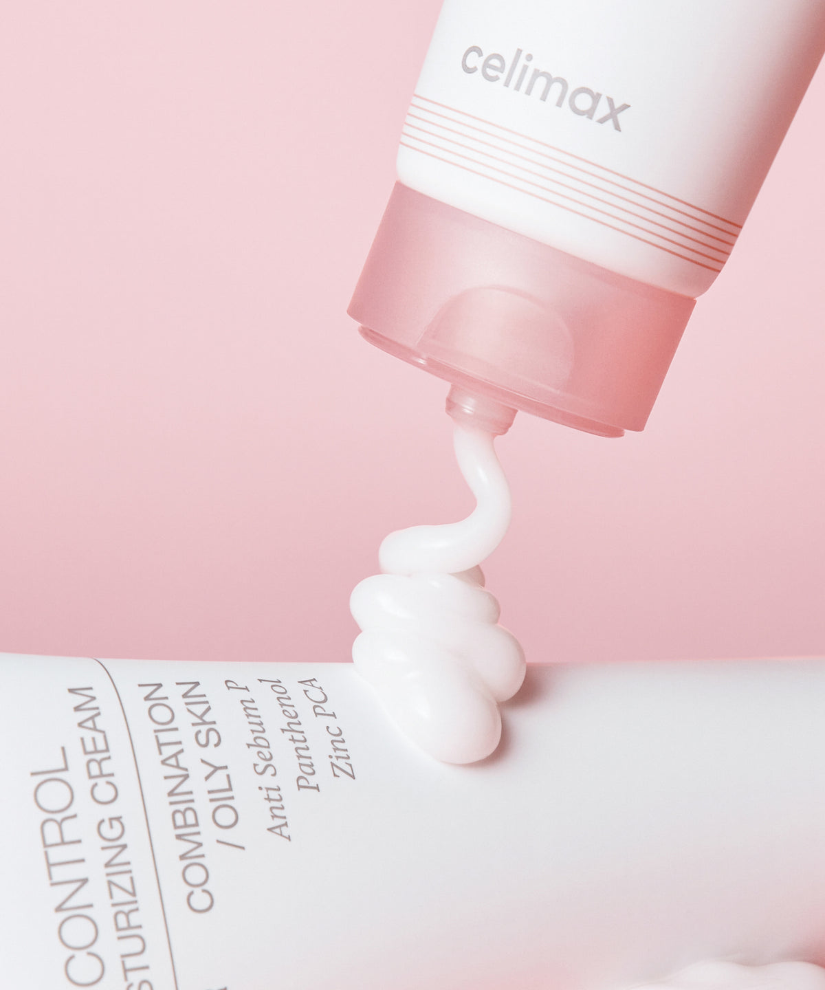 CELIMAX Oil Control Moisturizing Cream being dispensed through the open pink tube cap