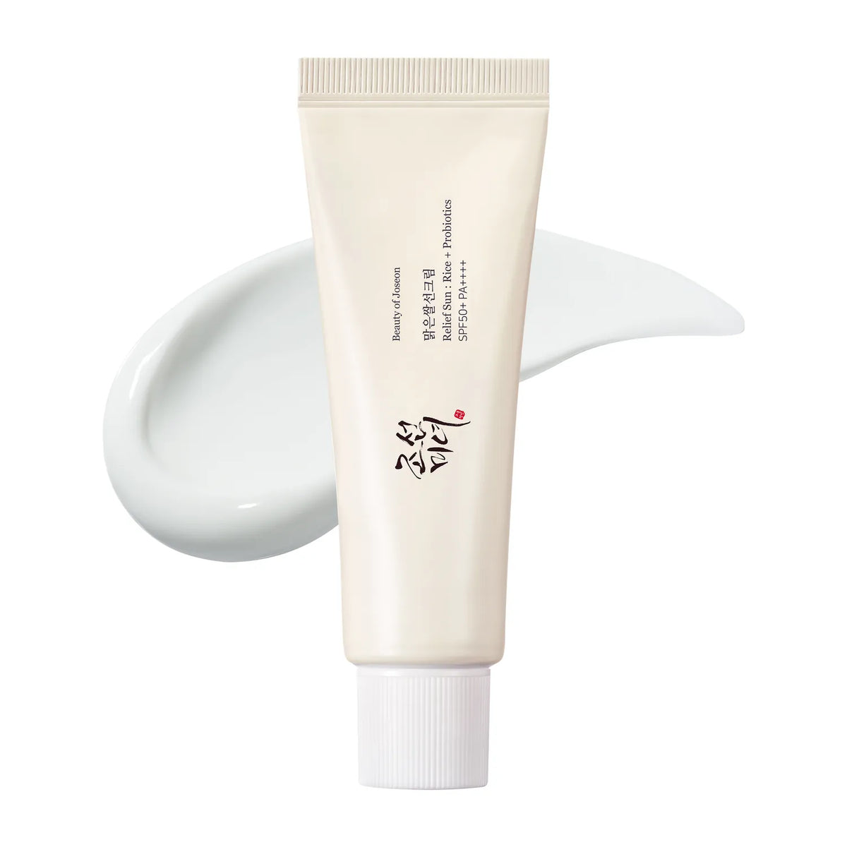 Beauty of Joseon Relief Sun Rice + Probiotics tube in front of a white cream smear