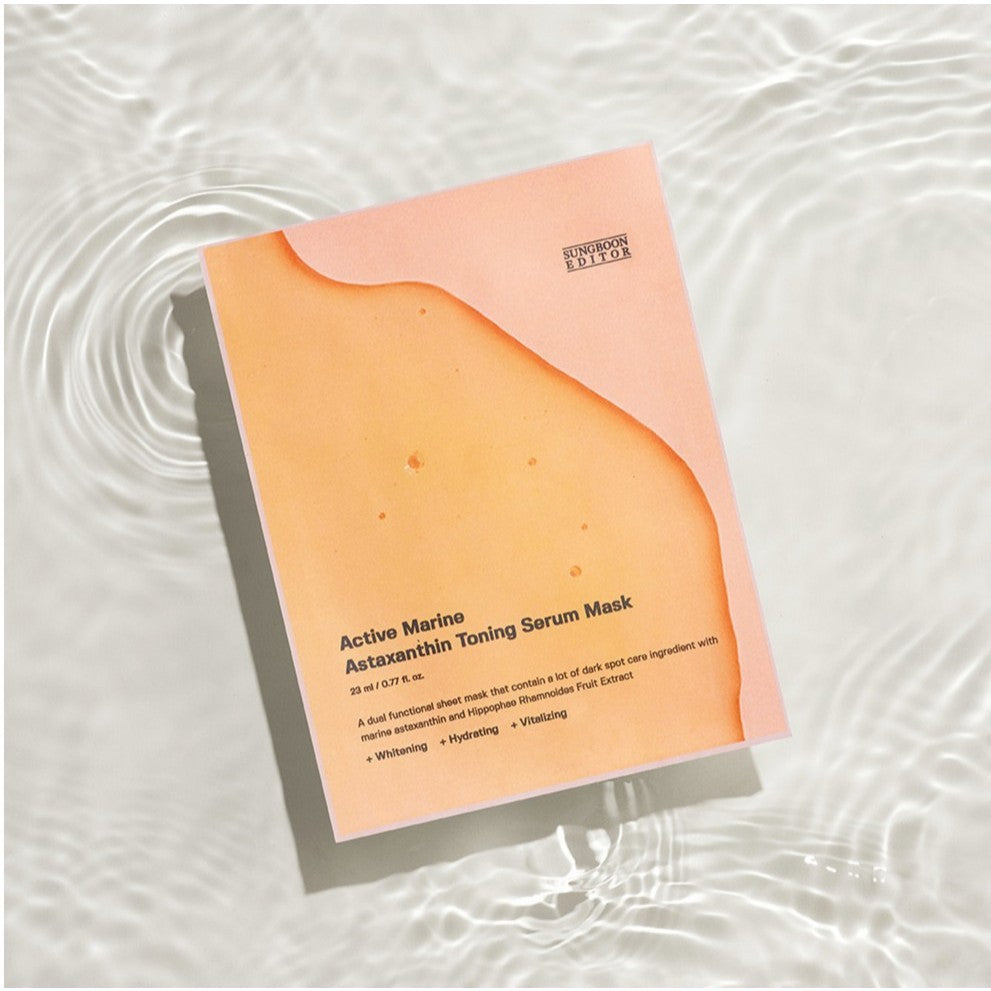 Orange sachet of SUNGBOON EDITOR Active Marine Astaxanthin Toning Serum Mask 23 ml on rippled water