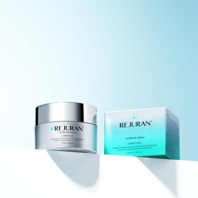 REJURAN Nutritive Cream 50ml silver jar beside its matching box on a white ledge